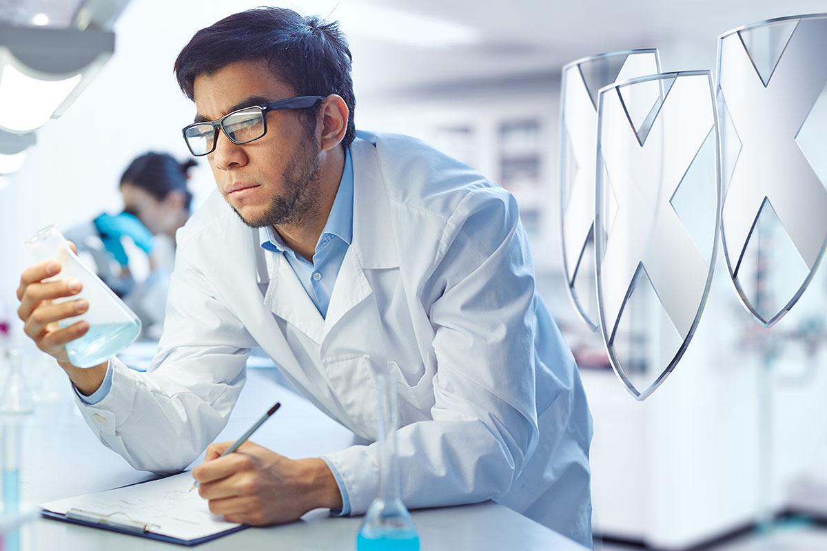 biologist analyzing chemicals and taking notes 