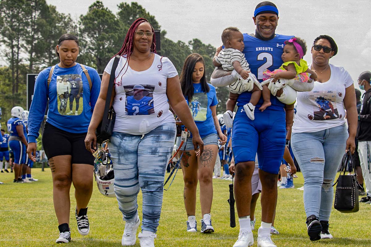 football player with family in the field