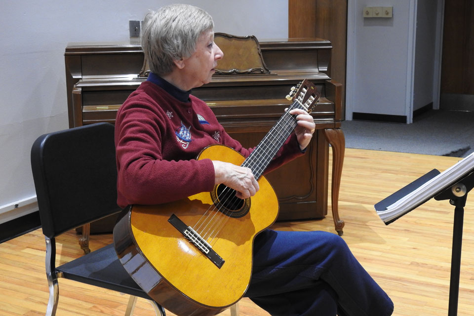 Alice Wilkins teaches Guitar class