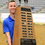 SAU equestrian competitor holding trophy
