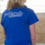 SAU equestrian member wearing blue "traditionally different" t-shirt