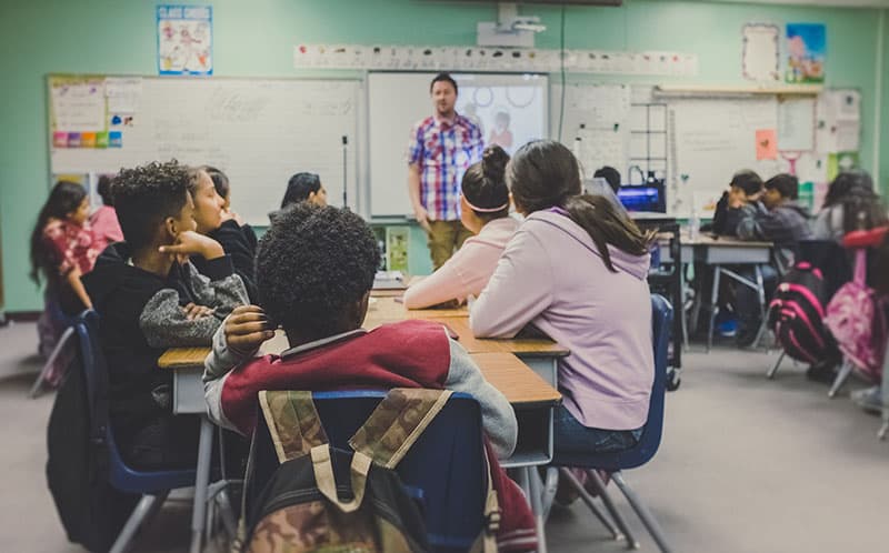 students and teacher in a classroom